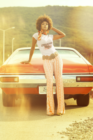 t-shirt-mockup-of-a-woman-posing-with-a-car-in-the-70s-m10508